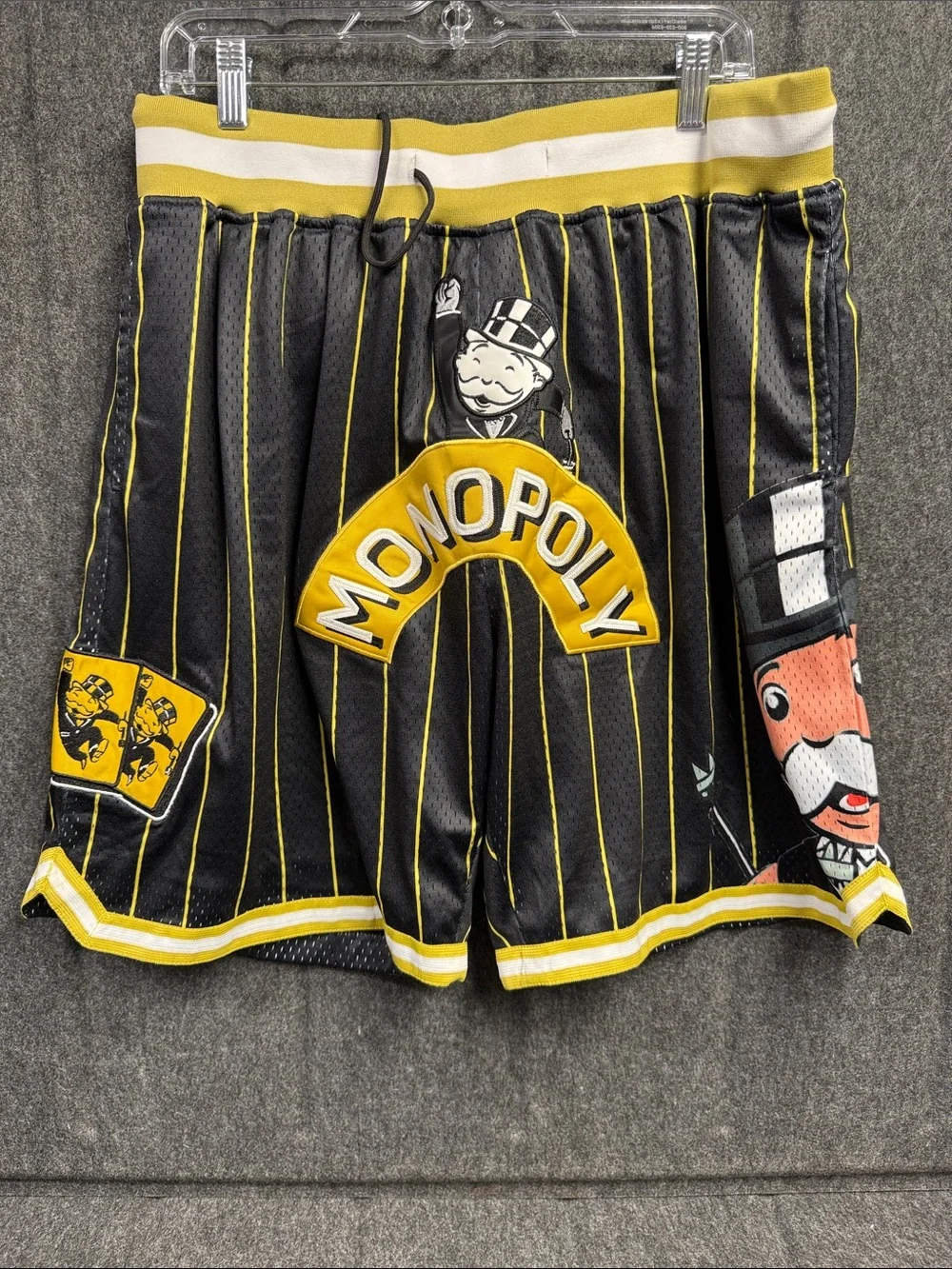 Monopoly Men’s Black & Yellow Athletic Shorts with Pinstripe Graphics